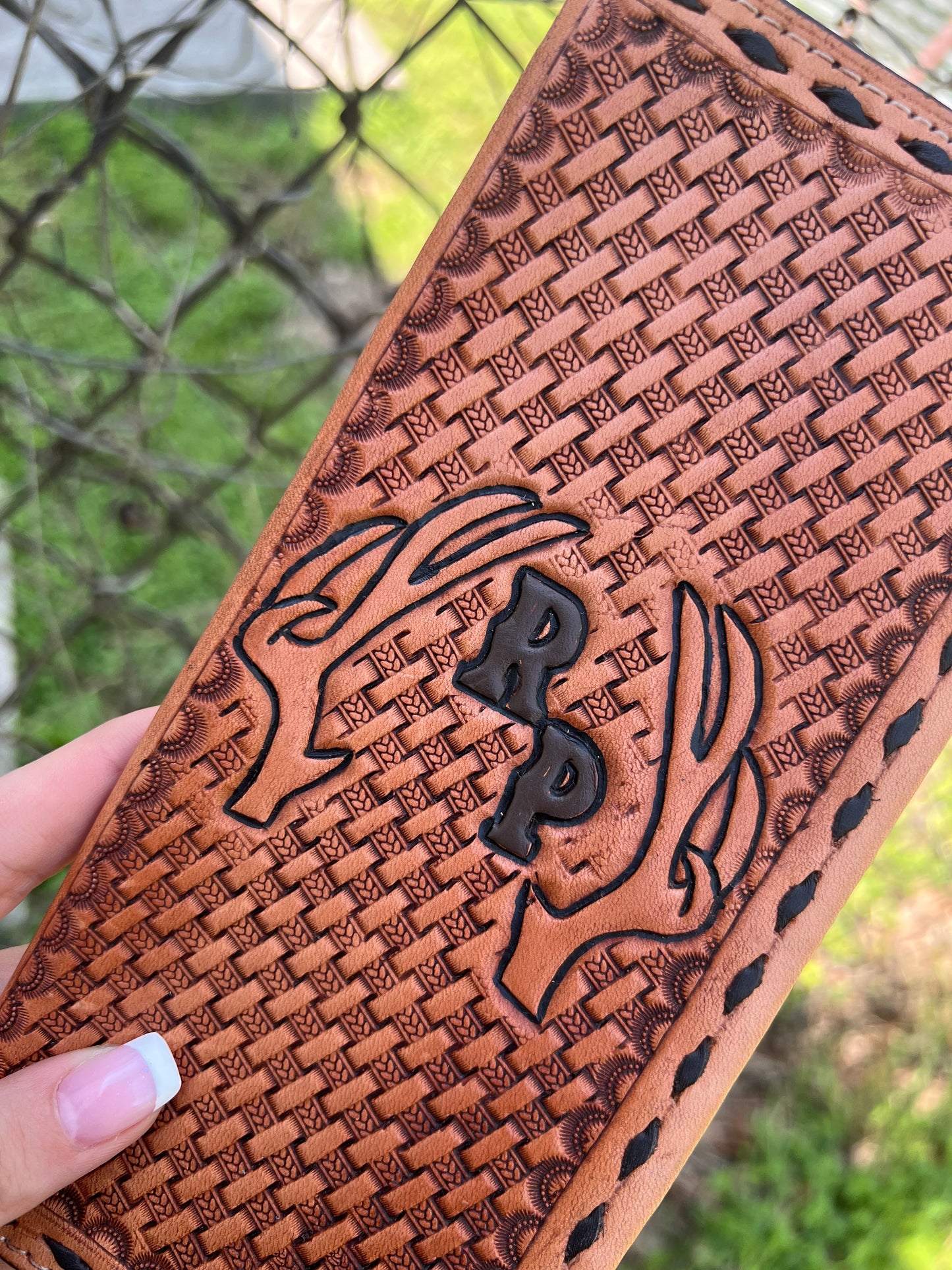 Tooled tally book with deer antlers and initials
