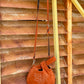 CATTLE BELL BAG- RUST