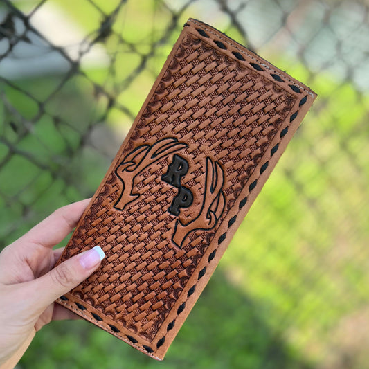 Tooled tally book with deer antlers and initials