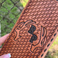 Tooled tally book with deer antlers and initials