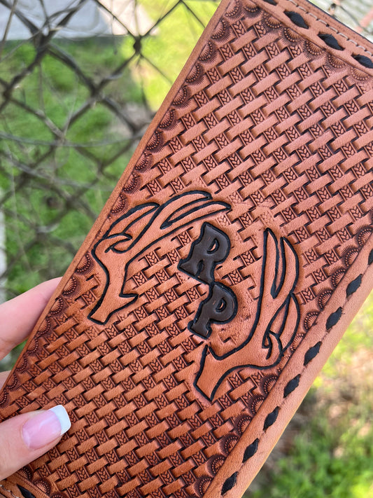 Tooled tally book with deer antlers and initials