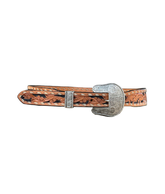 This is our women's TAPERED golden leather belt with black painted background and mini acorn tooling. It has single buck stitching around the border. It comes with a silver belt buckle and silver belt loop.  
