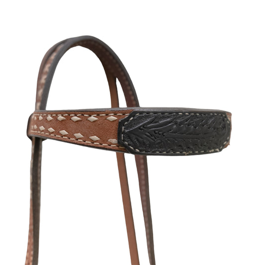 1-1/2" Contour browband headstall rough out toast leather with black oak leaf tooled patch, white buckstitch, braided loops, and Spanish lace hardware.