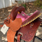 Youth rose barrel saddle back view.